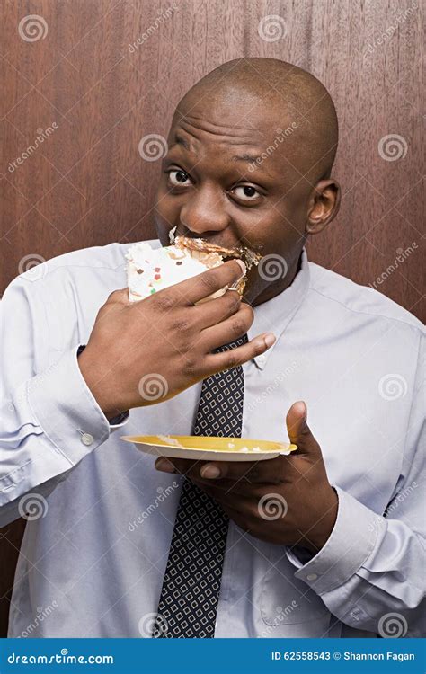 Businessman Secretly Eating Cake Stock Photos Free Royalty Free Stock Photos From Dreamstime
