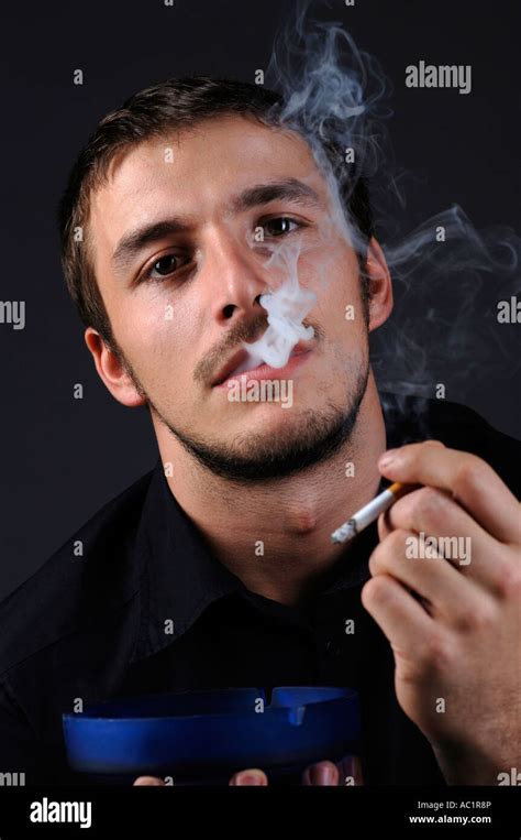Man Lighting A Cigarette Portrait Stock Photo Alamy