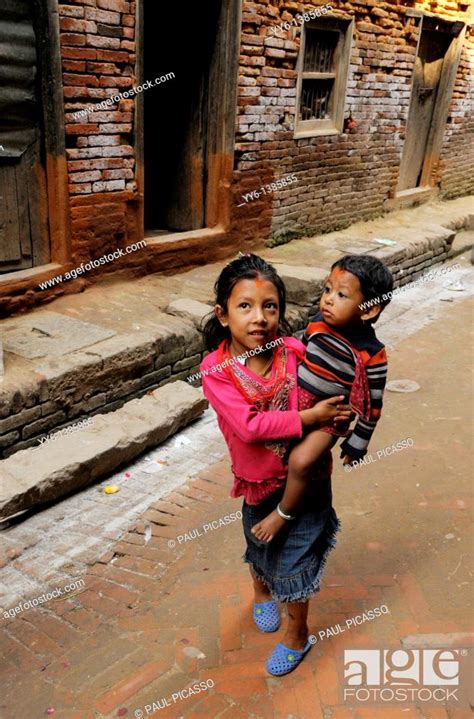 nepalis girl holding her brother the nepalis life in kathmandu kathmandu street life