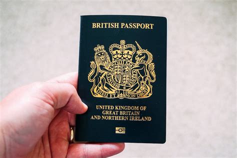 Crop Unrecognizable Person Demonstrating British Passport · Free Stock