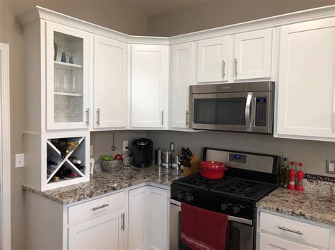 We recently used benjamin moore decorator's white on upper cabinets and farrow & ball down pipe on lower cabinets in a kitchen project and it turned out so well. What Color Should I Paint My Kitchen Cabinets? | Textbook Painting