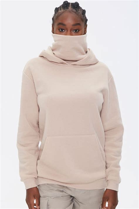 7 Cozy Sweatshirts That Come With Built In Face Masks