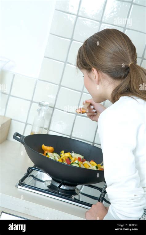 Woman Cooking Dinner Stock Photo Alamy