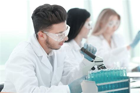 Close Upmale Scientist Conducting Research In The Laboratory Stock