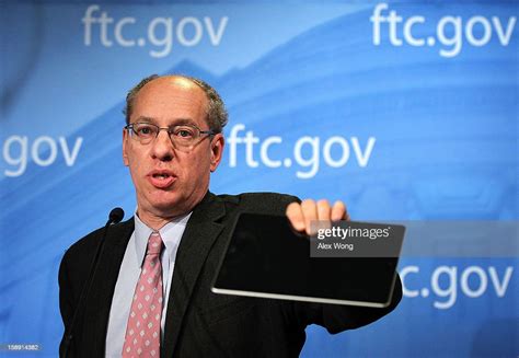 Us Federal Trade Commission Chairman Jon Leibowitz Holds Up An Ipad
