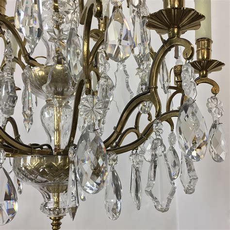 Antique brass six~light chandelier is loaded with crystal bead strands, large antique prisms, and lots of sparkly czech lead crystal prisms. Antique Venetian Brass and Crystal Chandelier