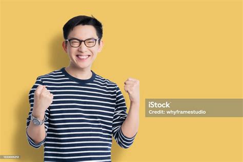 success exited asian attractive male cheerful hand rise upsmart asian glasses man big surprice