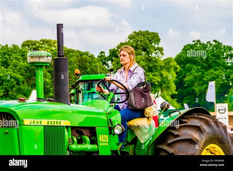 Female Farmer Driving A Tractor At The Northumberland County Show