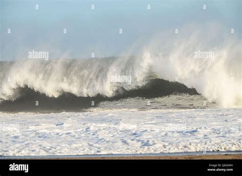 Big Blue Wave Breaks In The Atlantic Ocean Stock Photo Alamy