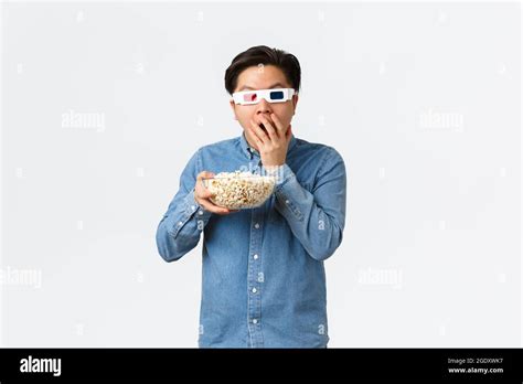 Leisure Lifestyle And People Concept Astonished Asian Guy In 3d Glasses Munching Popcorn