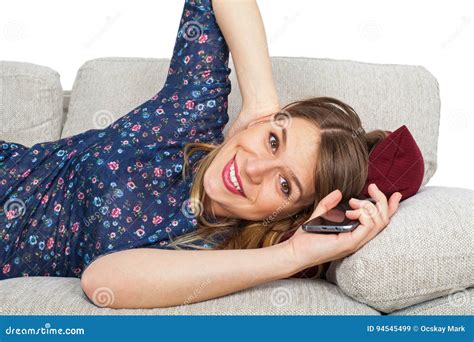 Seductive Woman On The Couch Holding Her Phone Stock Image Image Of