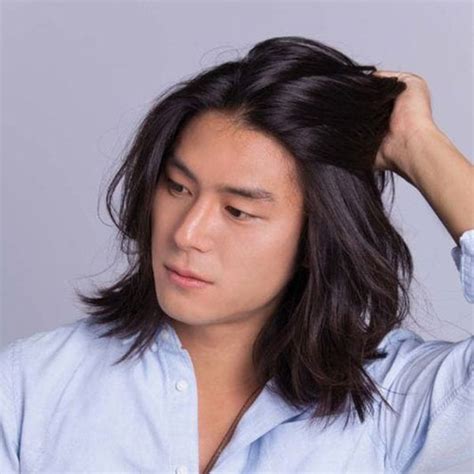 Overhead view of multicultural friends grimacing and hanging down from bed. 50 Best Asian Hairstyles For Men (2020 Guide)
