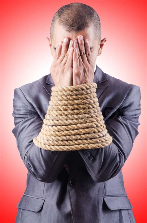 Businessman Tied Up With Rope Stock Image Colourbox