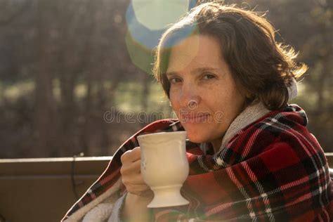 Woman Outside In Early Morning With Sunflare Reading A Book Stock Image Image Of Volume