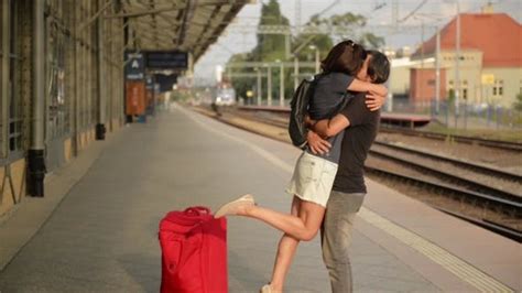 Happy Couple Embracing On Railway Station Platform Farewell At The Train Station Stock Footage