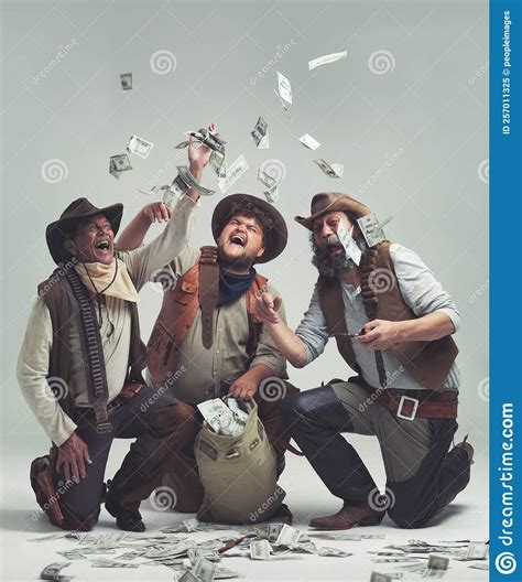 Pulling Of A Wild West Bank Job A Group Of Bandits Celebrating A