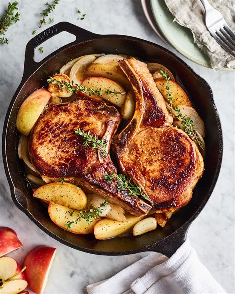 Oven oven baked pork chops covered in brown sugar and garlic on a sheet pan with yukon potatoes. Easy Skillet Pork Chops with Apples | Kitchn