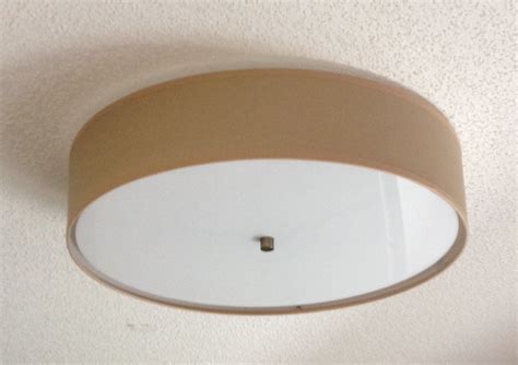 A ceiling fan with a light can help lower your electric bills for cooling in the summer, move warm air around your house during the winter, and brighten a room. Flush Mount Linen Drum Shade Light Fixture - S.T. Lighting ...