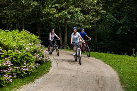 Healthy Lifestyle Happy People Riding Bicycles In City Park Stock Image Image Of Girls