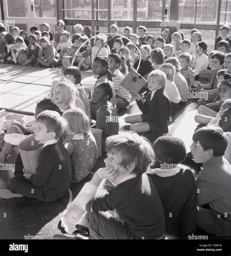 1960s Historical Excited Young School Children In The School Hall