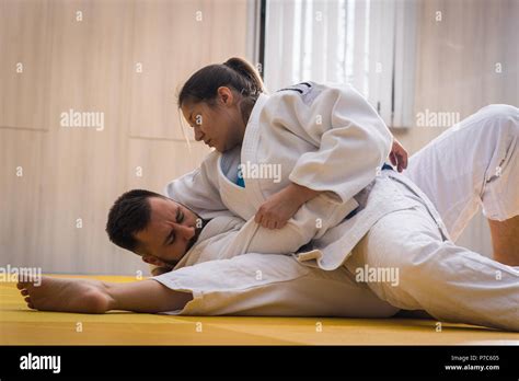 Young Woman And Man Judo Fighters In Sport Hall Stock Photo Alamy