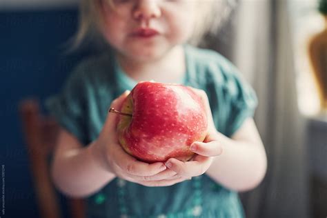 Child Eating An Apple By Stocksy Contributor Sally Anscombe Stocksy