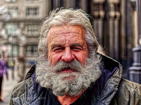 An Old Man With Grey Hair And A Beard