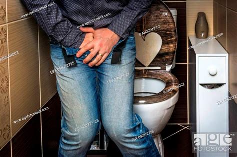 Man With Hands Holding His Crotch He Wants To Pee In Restroom