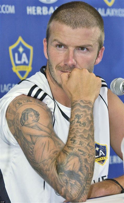 a look back at david beckham s 100 tattoos and their special meanings david beckham tattoos