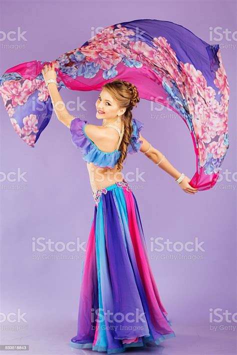 Beautiful Belly Dancer Wearing A Purple Costume Stock Photo Download