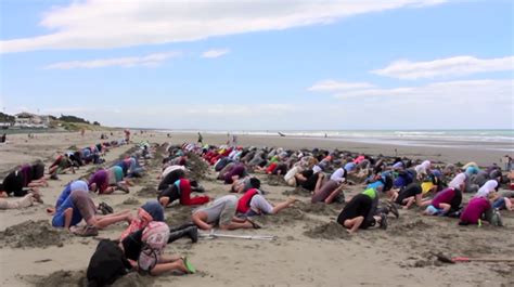 Why Hundreds Of New Zealanders Buried Their Heads In The Sand Together
