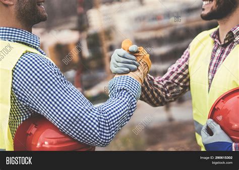 Young Builders Shaking Image And Photo Free Trial Bigstock