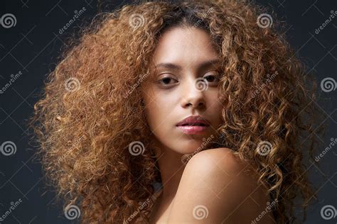 Beauty Portrait Of A Beautiful Female Fashion Model With Curly Hair