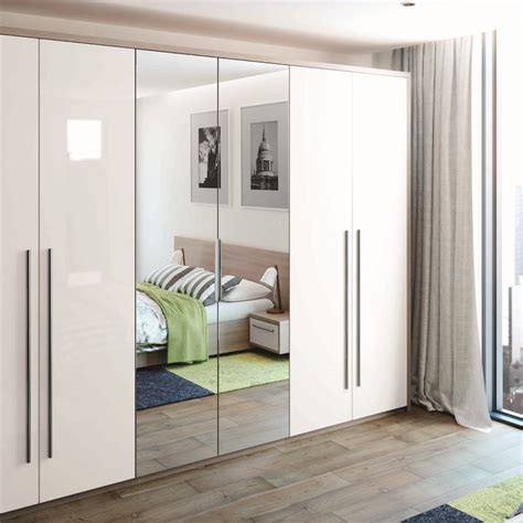 In a smaller room, it's hard to justify giving up square footage for a massive wardrobe. Pin on White gloss wardrobes