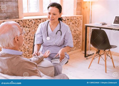 Cheerful Asian Female Working In Nursing Home Stock Photo Image Of