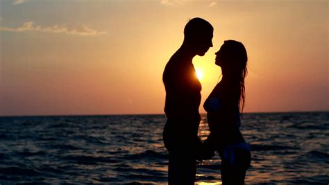 Couple Silhouette At The Beach Sunset Light Stock Footage Video