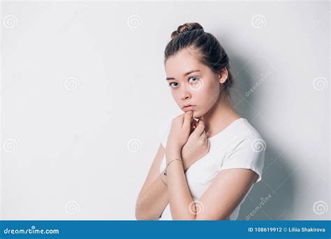 Young Beautiful Woman Serious And Concerned Looking Worried And Thoughtful Facial Expression