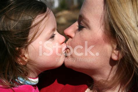 Mother And Daughter Kissing Stock Photo Royalty Free Freeimages