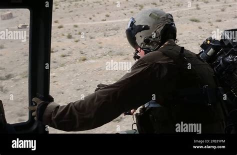 Door Gunner Looking Out From Helicopter During Flight Stock Video