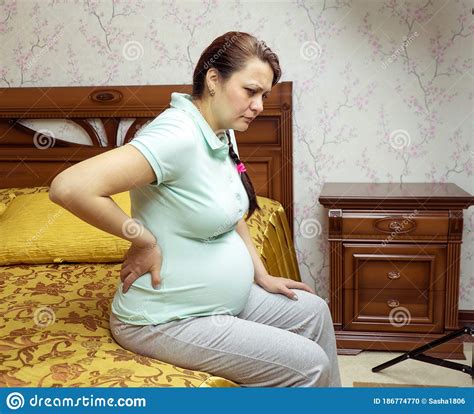 Pregnant Woman Back Pain Pregnant In Her Bedroom Stock Photo Image