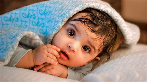 Beautiful Cute Baby Child Is Lying Down On Bed Under Bedsheet Hd Cute
