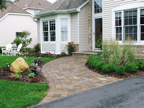 A Wide Curved Paver Walkway And Plantings Create A Much More Welcoming