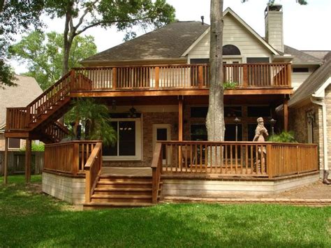 The facade of your house should create a memorable aesthetic experience. two-story deck! | Second story deck, Decks backyard ...