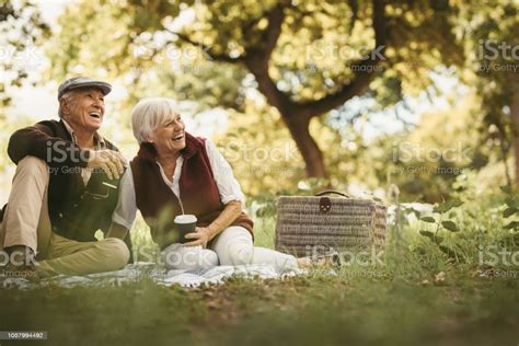 Senior Couple Having A Great Time On A Picnic Stock Photo - Download 