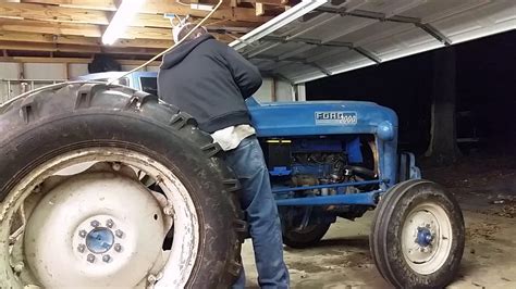 How to start a tractor after running out of fuel. 1964 Ford 2000 tractor start up - YouTube