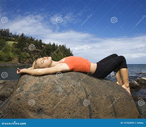 Attractive Young Woman Lying On Rock At Beach Royalty Free Stock Images Image 12752959