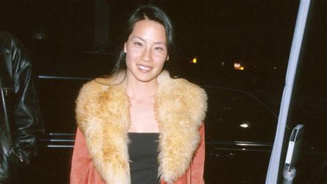 Great Outfits In Fashion History Lucy Liu In A Red Suede Coat