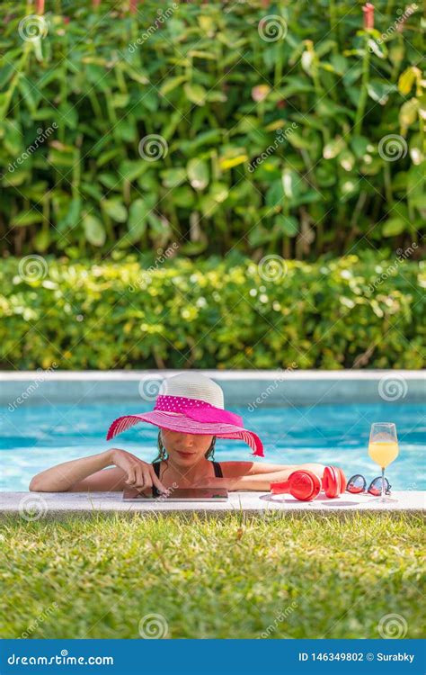 Woman Using Tablet Computer In Pool Stock Photo Image Of Beauty Asian