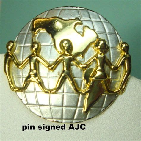 sale ajc signed pin people around the world on a round gold etsy gold globe silver tone