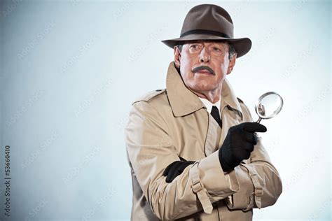 Retro Detective Man With Mustache And Hat Holding Magnifying Gl Stock